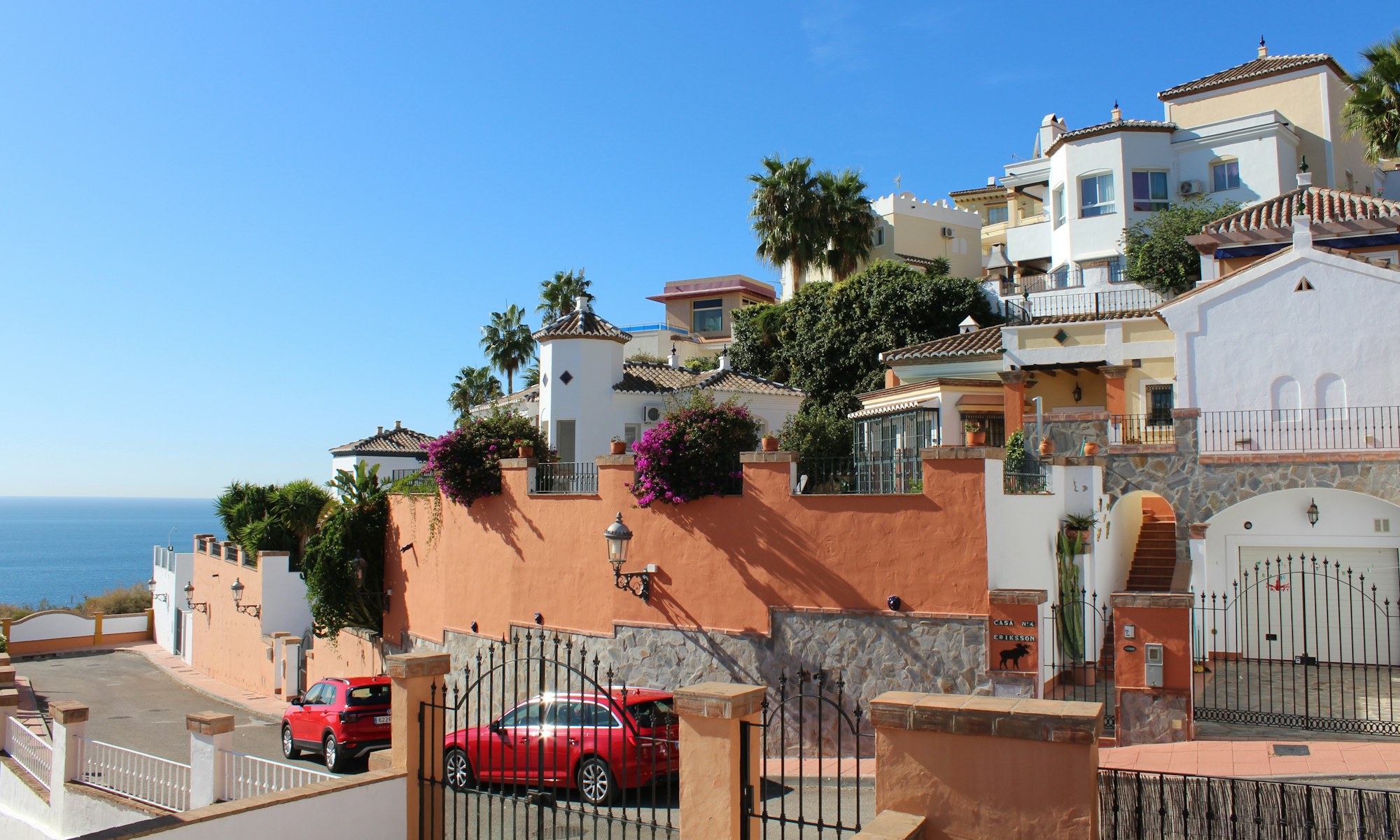 Hillside Andalusian villas with bougainvillea and sea view