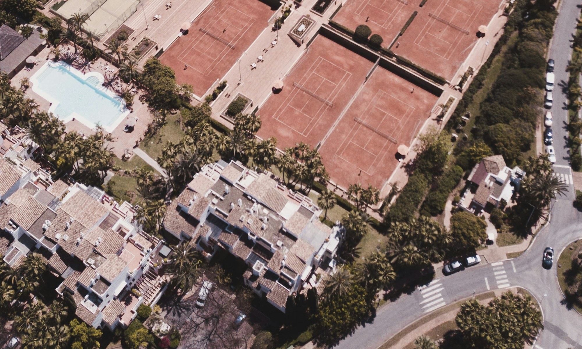 Aerial view of Puerto Banús with tennis club, pools and beachfront residences